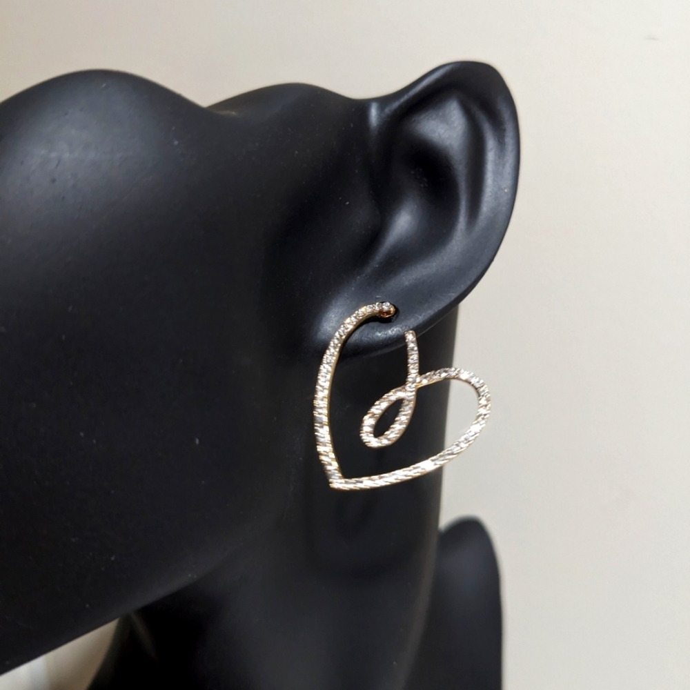 Heart shaped rhinestone and gold earrings.